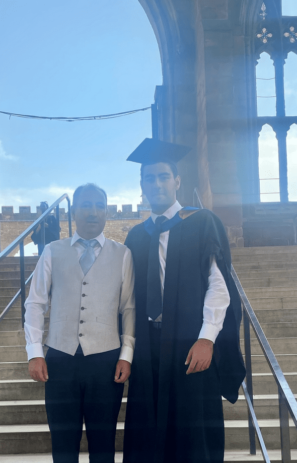 baran and his father on baran's graduation day